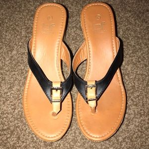 Women’s black and brown wedge sandal